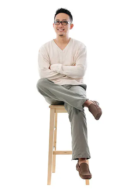 man sit on a tall chair